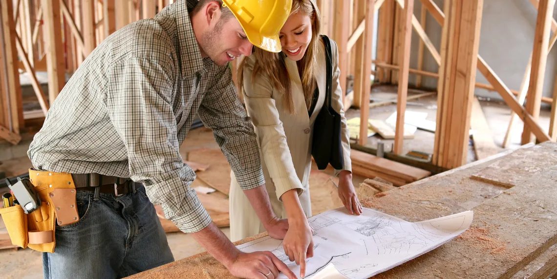 general contractor los angeles client consultation reviewing construction plans project planning