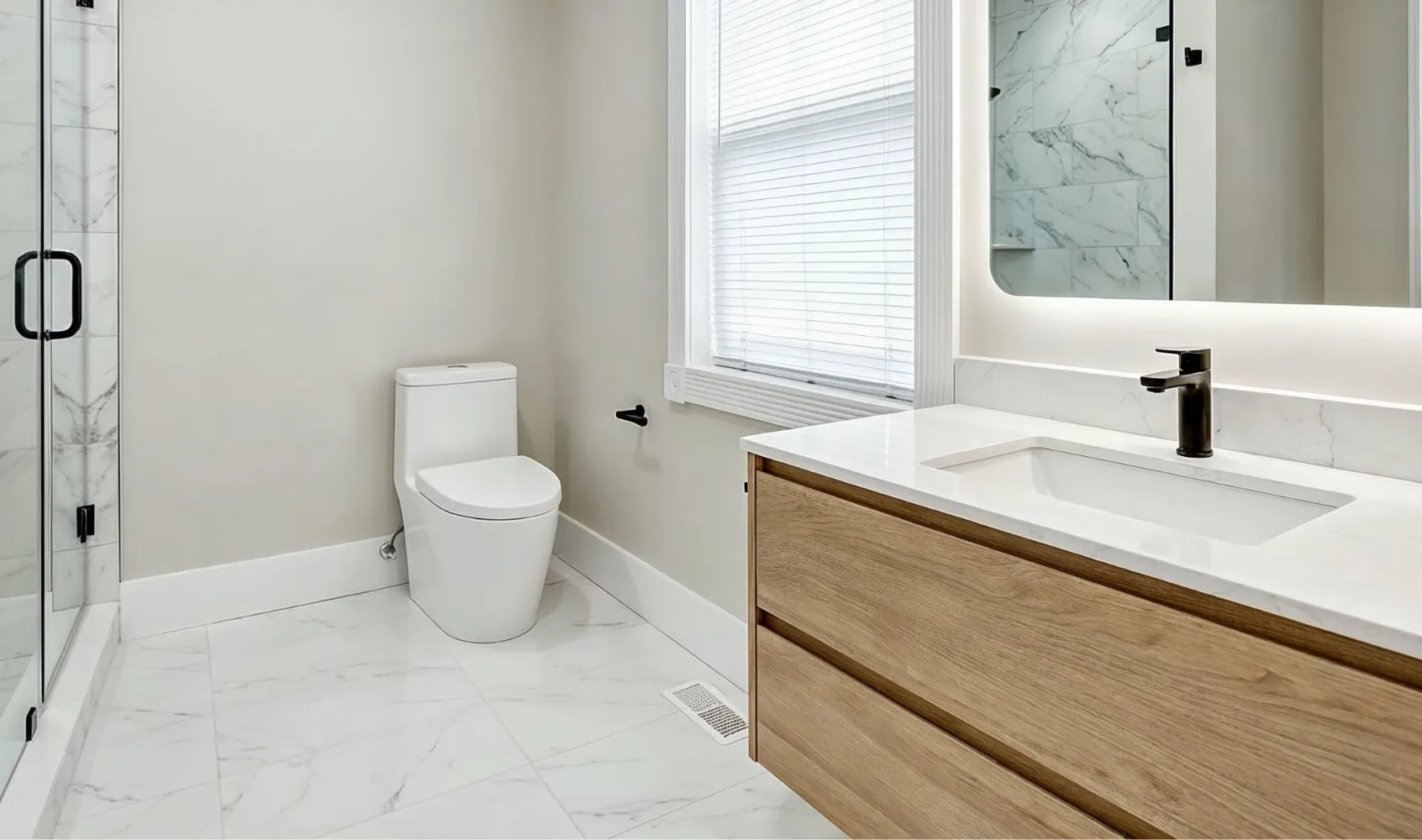 Modern bathroom remodeling project in Los Angeles with walk-in shower, floating vanity, marble tile, and minimalist design