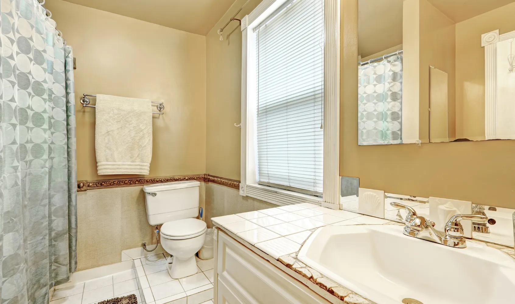 Outdated bathroom in Los Angeles with old tile, basic fixtures, and inefficient layout before renovation