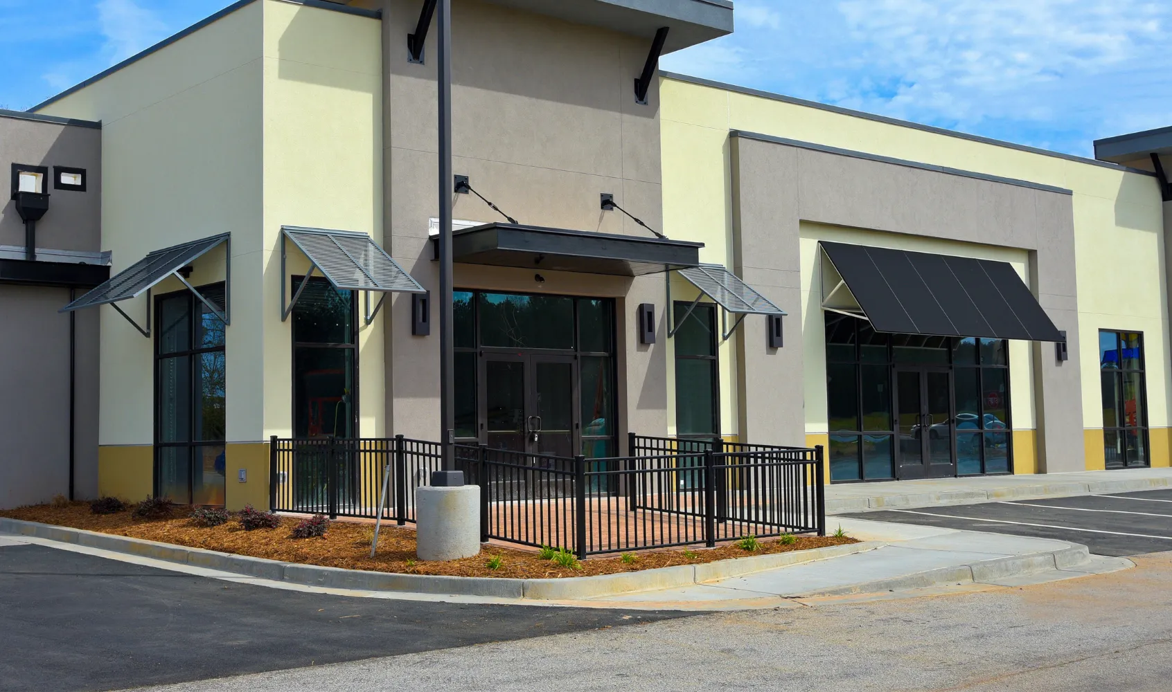 Completed commercial construction project in Los Angeles featuring modern retail building with storefront glass and finished exterior