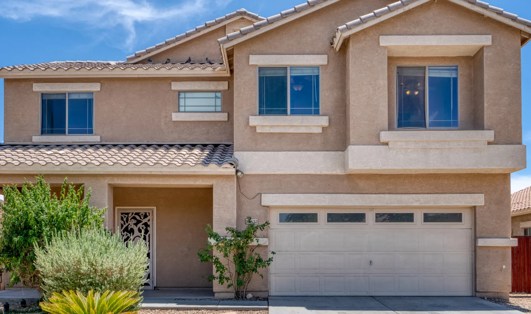Completed new home construction in Los Angeles featuring modern two-story house with finished exterior and driveway