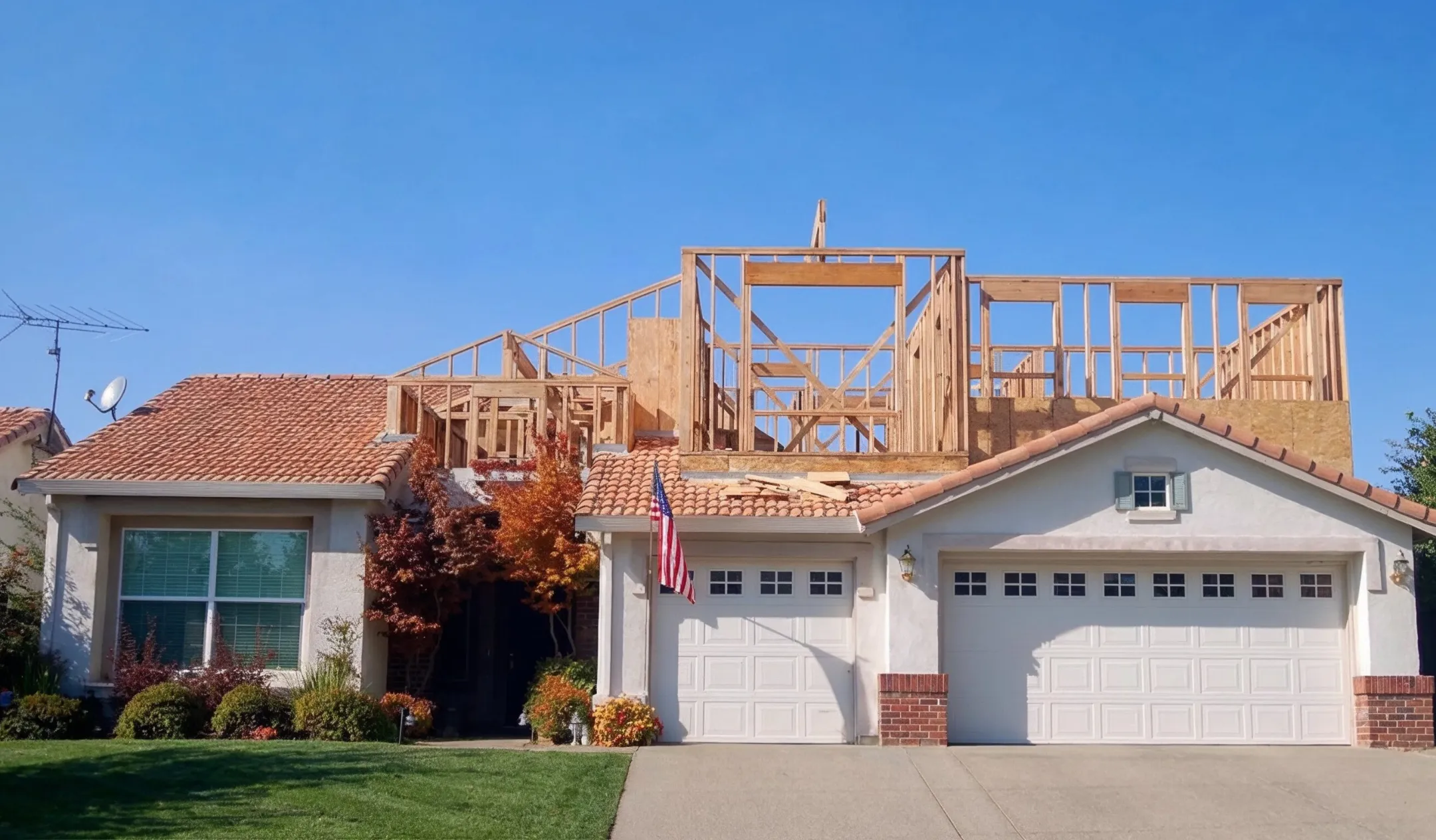 Room additions project in Los Angeles showing second story home expansion with new wood framing structure built above existing house
