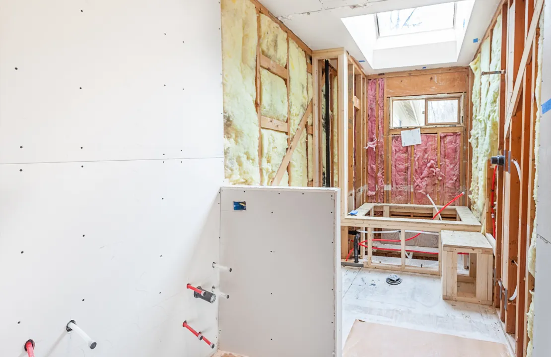 Bathroom remodeling project in Los Angeles with shower framing and plumbing renovation work in progress