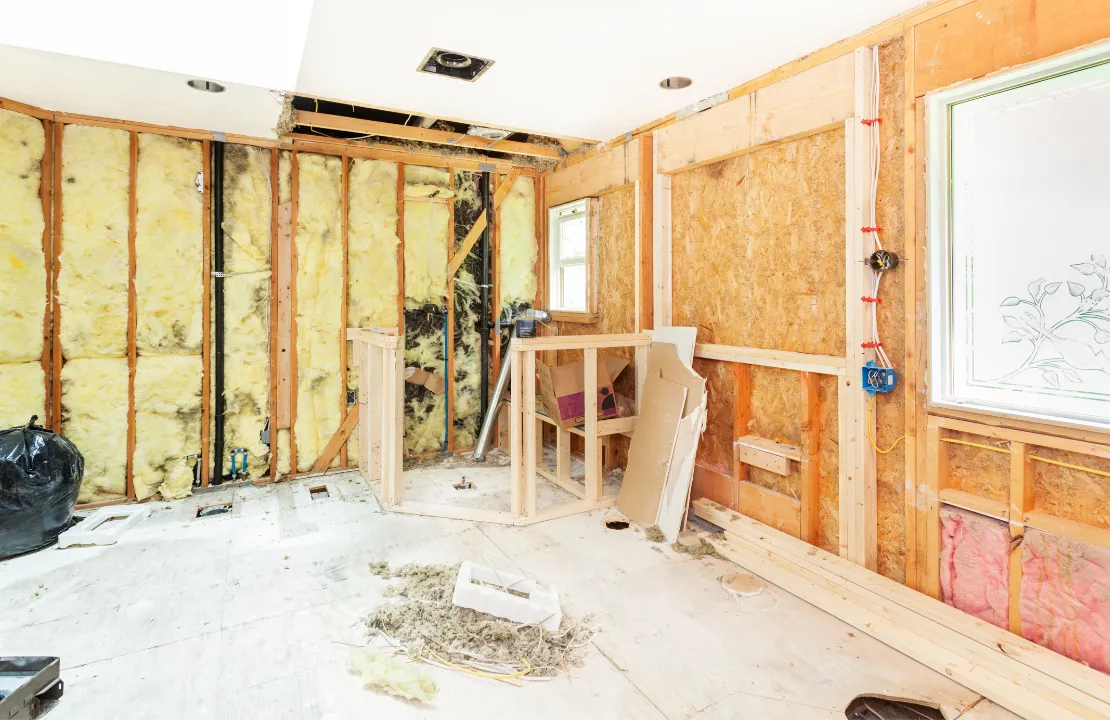 Home remodeling site in Los Angeles with interior demolition and renovation framing work in progress with construction crew